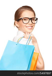 happy woman with shopping bags over white&#xA;