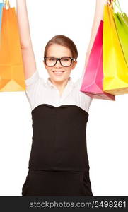 happy woman with shopping bags over white&#xA;