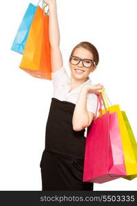 happy woman with shopping bags over white&#xA;