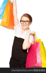 happy woman with shopping bags over white&#xA;