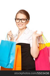 happy woman with shopping bags over white&#xA;