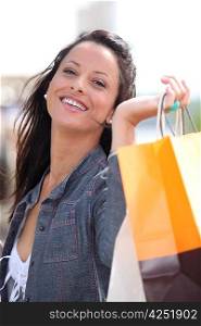 Happy woman with store bags