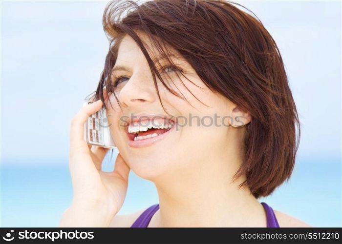 happy woman with white phone (focus on smile)