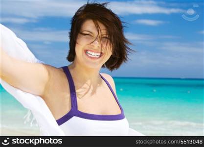 happy woman with white sarong on the beach&#xA;