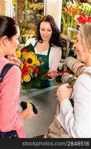 Happy women customers buying flowers sunflower bouquet shop florist