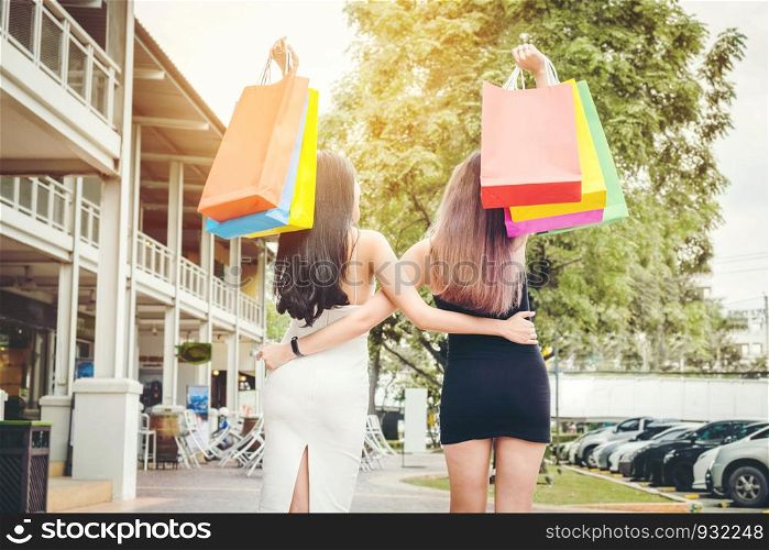 Happy women friendship Enjoying Spending shopping bags in Fashion shopping street