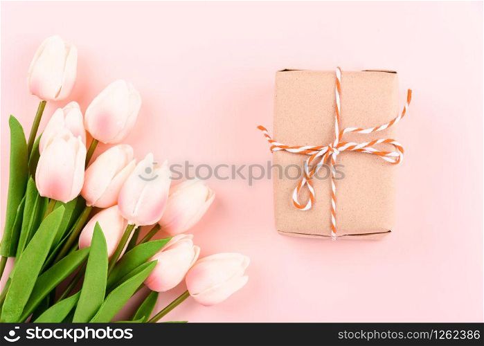 Happy Women&rsquo;s Day, Mother&rsquo;s Day concept. top view flat lay gift box and Tulip flower on pink background, copy space for your text