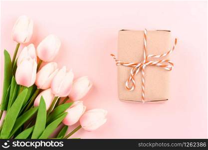 Happy Women&rsquo;s Day, Mother&rsquo;s Day concept. top view flat lay gift box and Tulip flower on pink background, copy space for your text