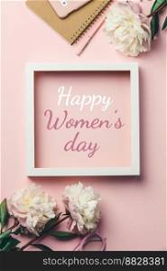 Happy women’s day greeting card  mobile phone, glasses and flowers on a pink background, top view, flat lay