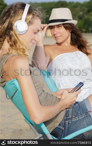 happy women with a tablet during holidays