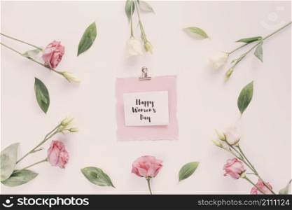 happy womens day inscription with rose flowers