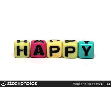 happy - word made from multicolored child toy cubes with letters