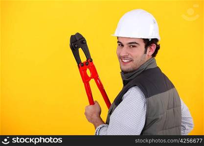 Happy workman on yellow background