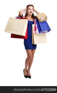 Happy young adult woman with colored bags