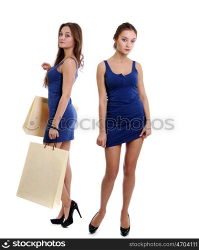 Happy young adult woman with colored bags