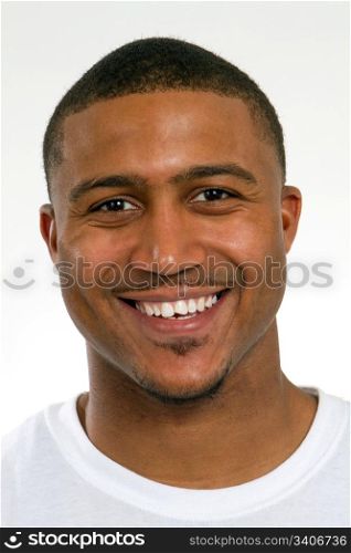 Happy young African American college student with a chipped tooth has a big smile.