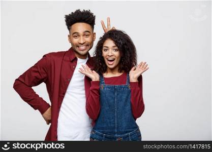 Happy young African couple dressed casually having fun together. Happy young African couple dressed casually having fun together.