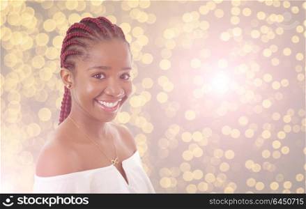 Happy young african girl with lights