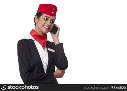 Happy young airhostess on call isolated over white background