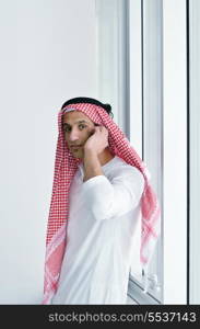 happy young arabic business man working at bright office