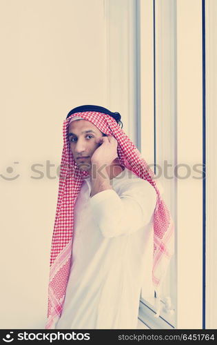 happy young arabic business man working at bright office