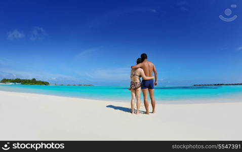 happy young asian couple enjoying summer and have on beautiful white sand beach