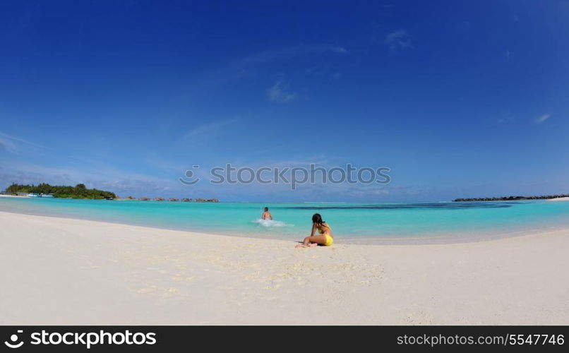 happy young asian couple have fun and romantic time at summer on beautiful white sand beach