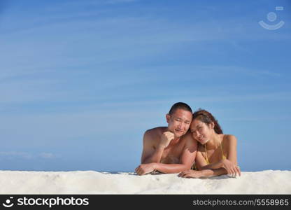 happy young asian couple have fun and romantic time at summer on beautiful white sand beach