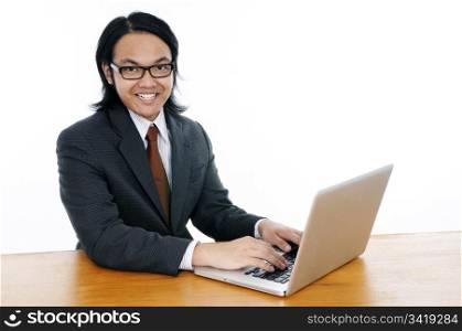Happy Young Asian Man Using Laptop