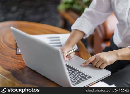 Happy young Asian Woman working on computer Business Data Analyst