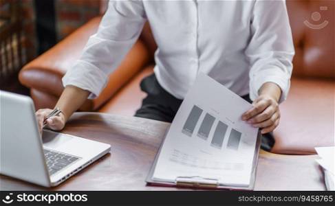 Happy young Asian Woman working on computer Business Data Analyst