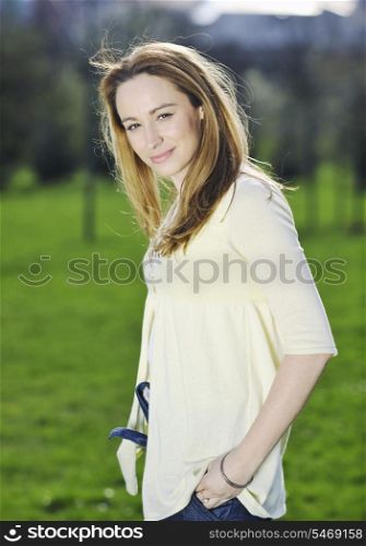 happy young beautiful woman face closeup and portrait outdoor at sunny day