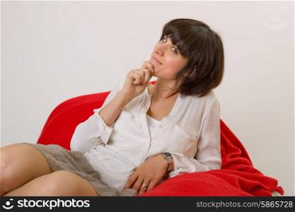 happy young beautiful woman relaxing on sofa at home