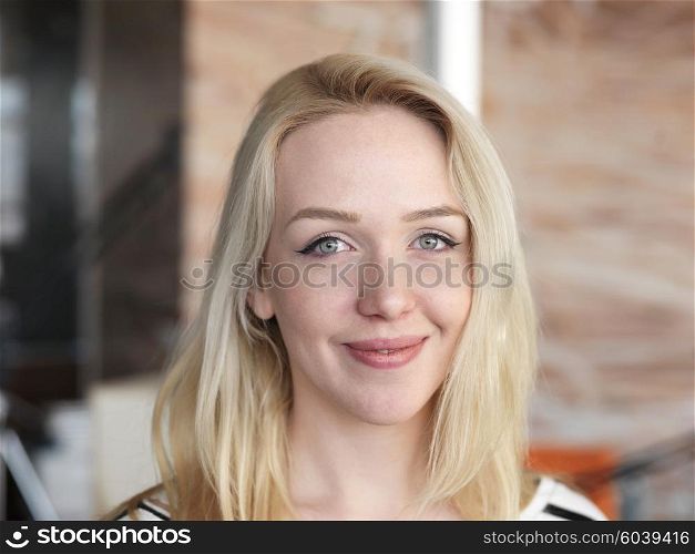 happy young blonde business woman portrait at office