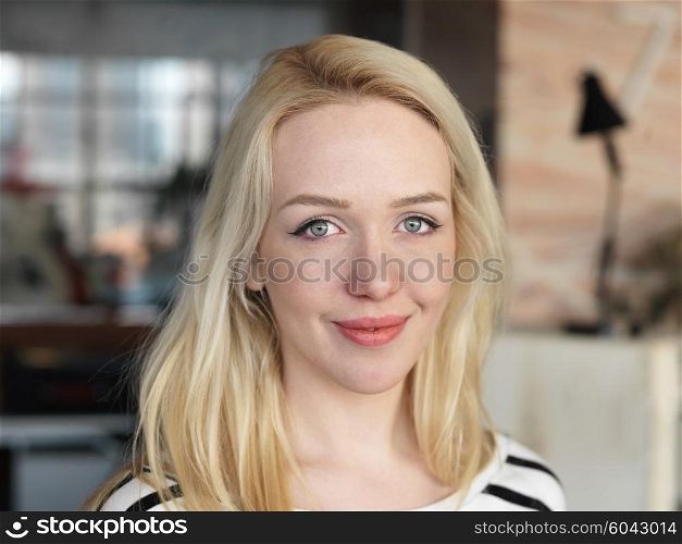 happy young blonde business woman portrait at office