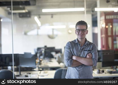 happy young business man at modern startup office