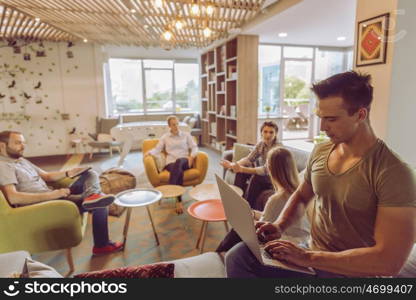 happy young business man at modern startup office