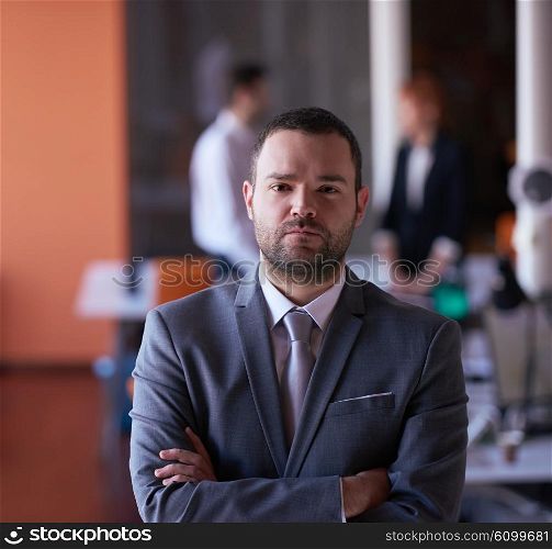happy young business man portrait at modern meeting office indoors