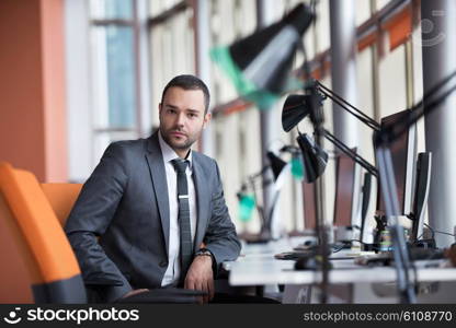 happy young business man portrait in bright modern office indoor