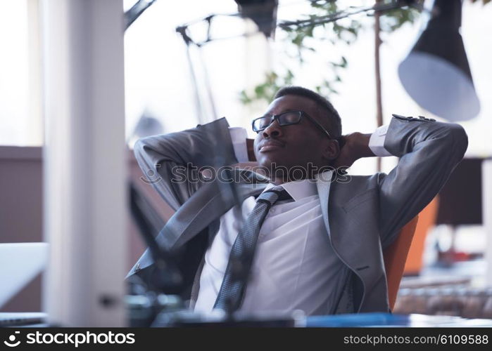 happy young business man portrait in bright modern office indoor