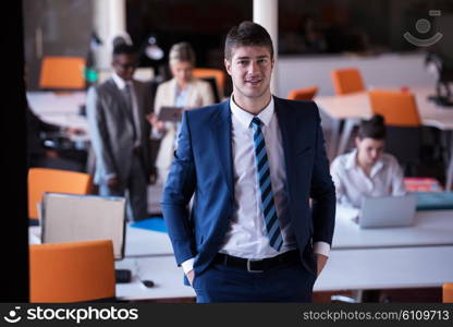 happy young business man portrait in bright modern office indoor