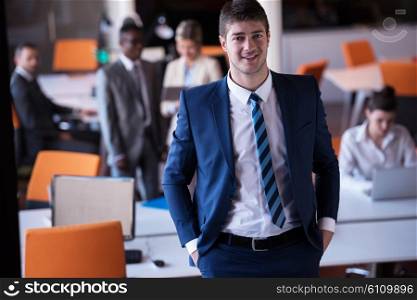 happy young business man portrait in bright modern office indoor