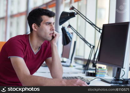 happy young business man portrait in bright modern office indoor