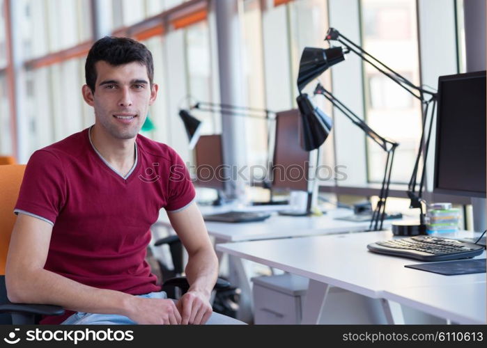 happy young business man portrait in bright modern office indoor