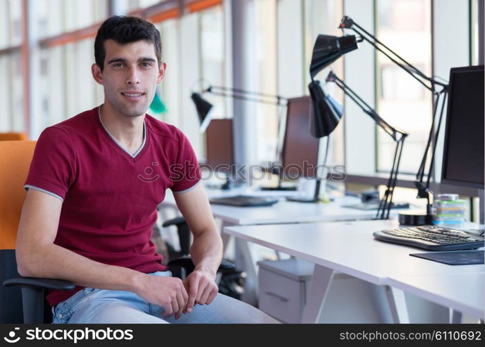 happy young business man portrait in bright modern office indoor