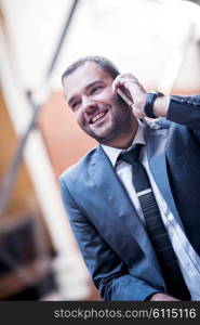 happy young business man portrait in bright modern office indoor