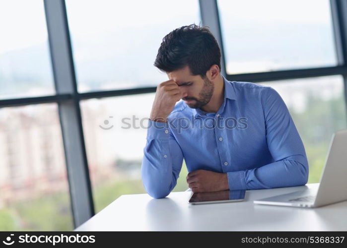 happy young business man work in modern office on computer