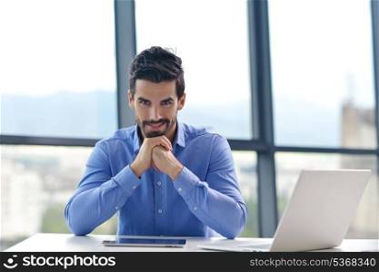 happy young business man work in modern office on computer