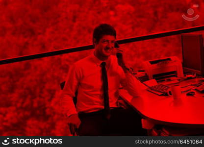 happy young business man work in modern office on computer