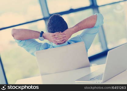 happy young business man work in modern office on computer